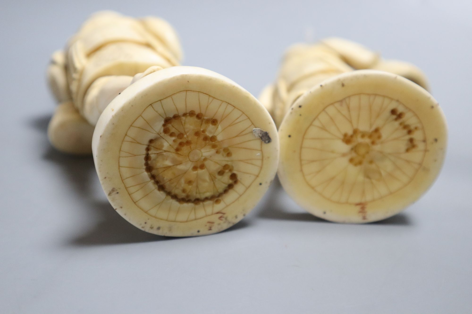 Two late 19th century Japanese okimono carved ivory figures of fishermen, height 19cm